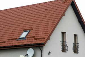 Roof of a new house made from yellow roofing tiles